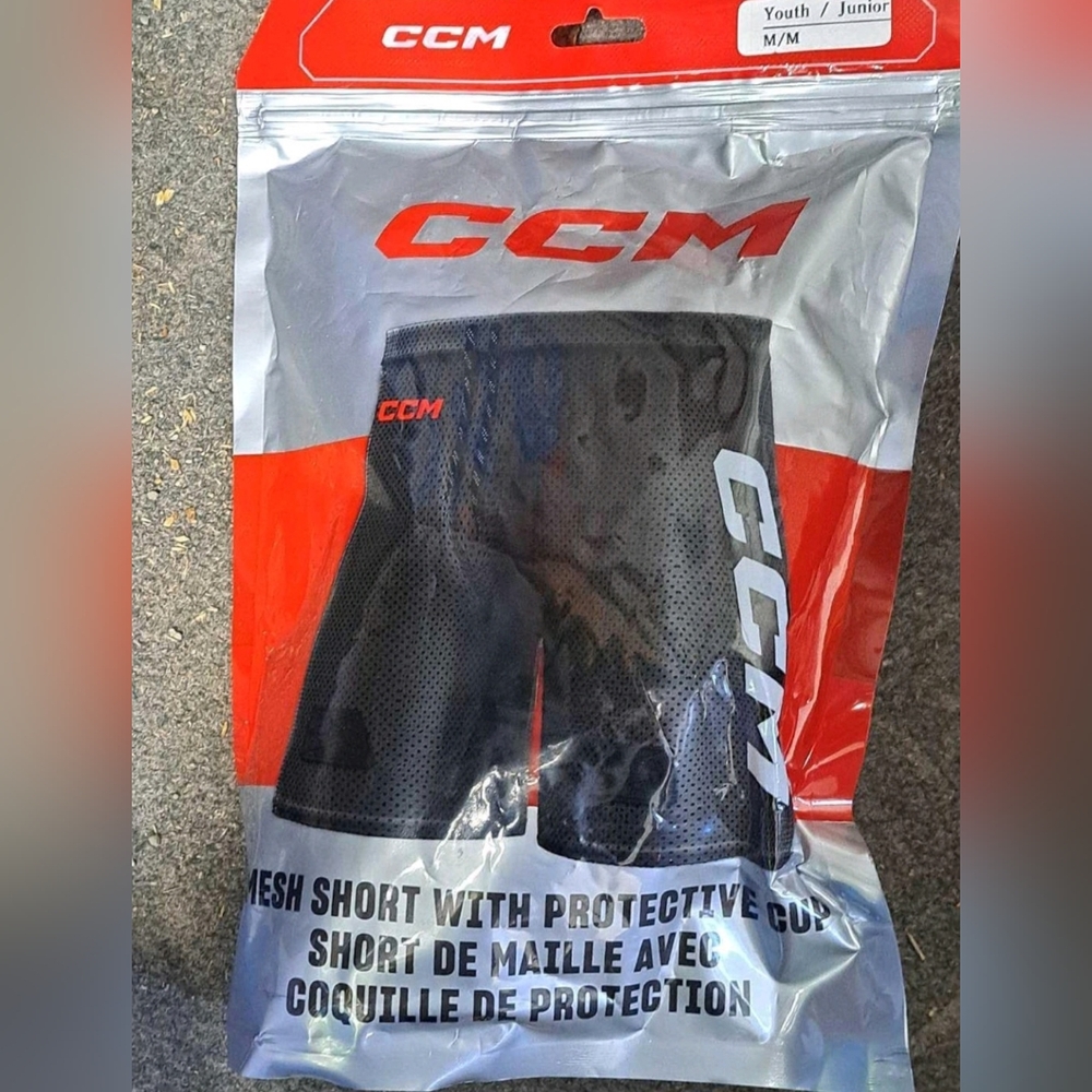 Brand New Youth CCM mesh shorts with protective cups